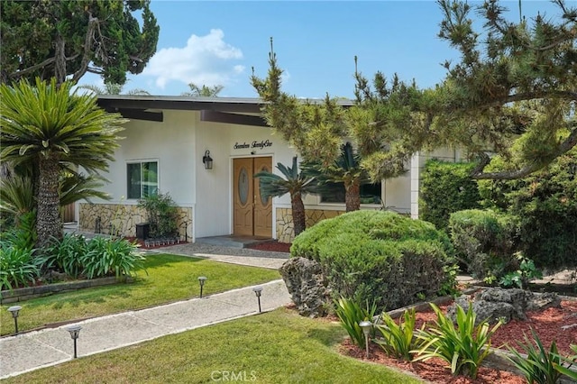 1721 S 3rd Ave, Arcadia, CA 91006 - view of front of home with a front lawn, stucco siding, and stone siding