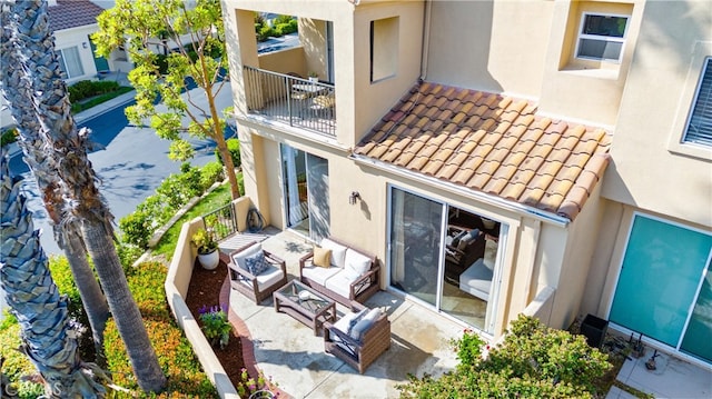 3 Fleurance St, Laguna Niguel, CA 92677 - back of property with outdoor lounge area, stucco siding, a balcony, a tile roof, and a patio area