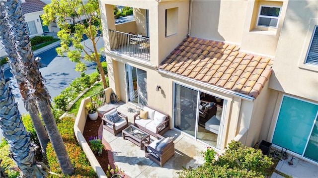 3 Fleurance St, Laguna Niguel, CA 92677 - back of house featuring an outdoor living space, stucco siding, a tiled roof, a balcony, and a patio area
