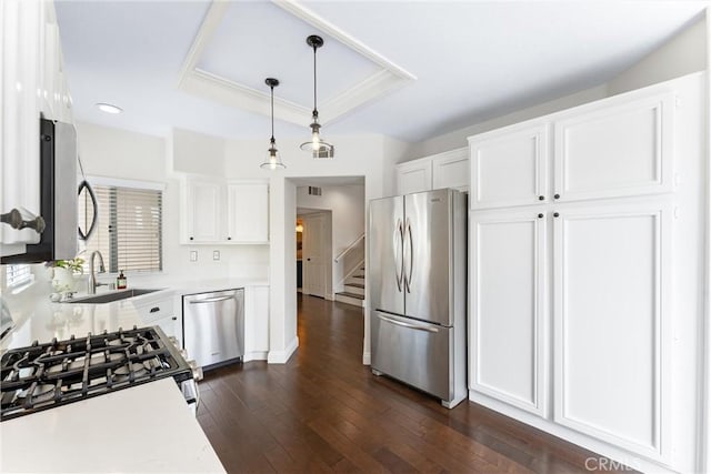 3 Fleurance St, Laguna Niguel, CA 92677 - kitchen with appliances with stainless steel finishes, light countertops, white cabinets, dark wood-type flooring, and a raised ceiling