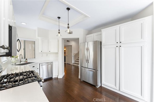 3 Fleurance St, Laguna Niguel, CA 92677 - kitchen featuring stainless steel appliances, light countertops, white cabinets, dark wood finished floors, and decorative light fixtures