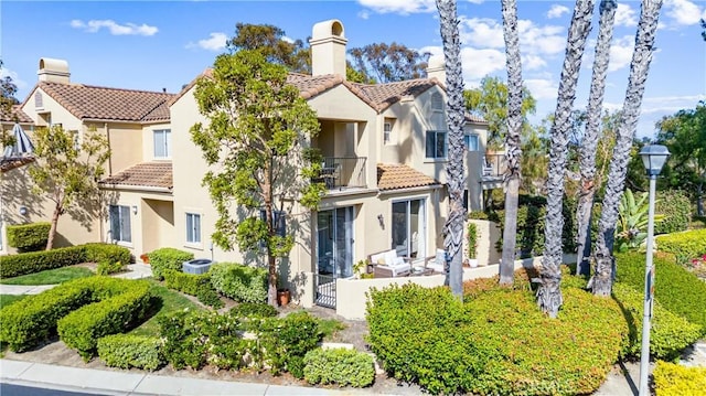 3 Fleurance St, Laguna Niguel, CA 92677 - view of front of house with a balcony, a tile roof, and stucco siding