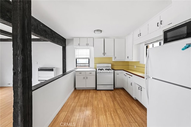 1634 Bayview Dr, Hermosa Beach, CA 90254 - kitchen featuring white appliances, light wood-style floors, and white cabinets
