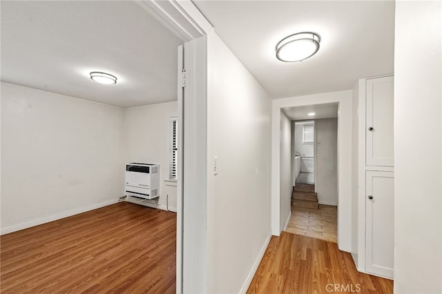 1634 Bayview Dr, Hermosa Beach, CA 90254 - corridor with heating unit, wood finished floors, and baseboards