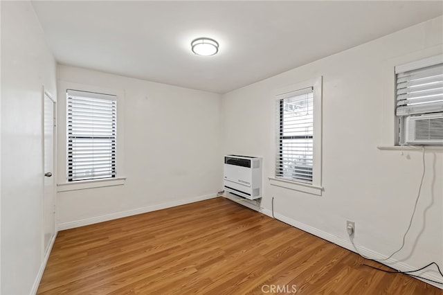 1634 Bayview Dr, Hermosa Beach, CA 90254 - unfurnished room with heating unit, light wood-type flooring, plenty of natural light, and baseboards