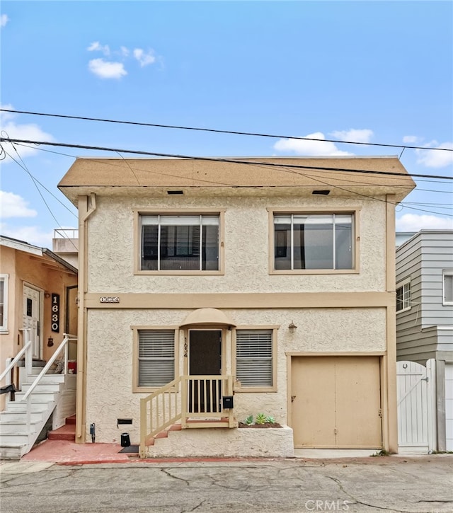 1634 Bayview Dr, Hermosa Beach, CA 90254 - view of property with stucco siding and a gate