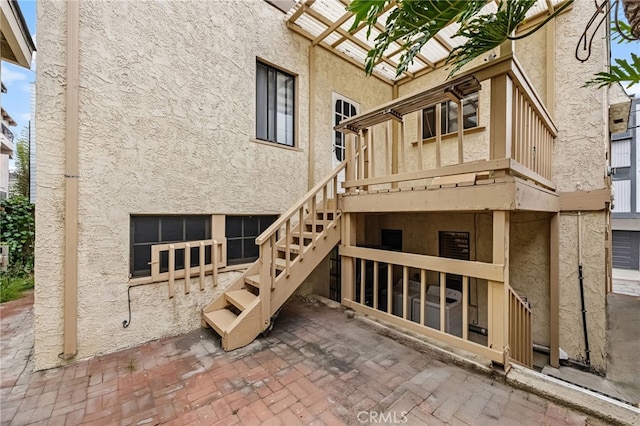 1634 Bayview Dr, Hermosa Beach, CA 90254 - back of house featuring stucco siding, stairs, and a patio area