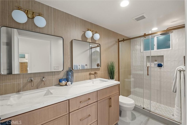 1529 Steinhart Ave, Redondo Beach, CA 90278 - full bathroom featuring toilet, double vanity, a shower stall, decorative backsplash, and tile patterned flooring