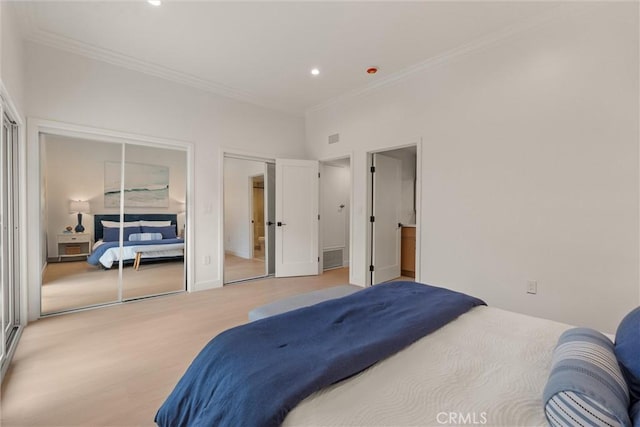 1529 Steinhart Ave, Redondo Beach, CA 90278 - bedroom with crown molding, wood finished floors, recessed lighting, and two closets