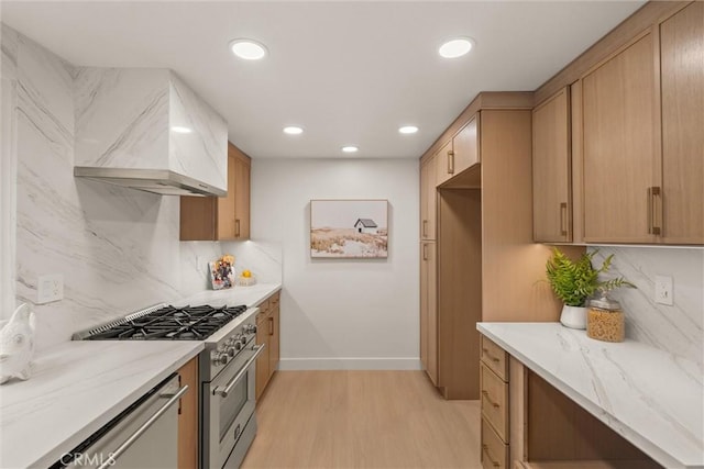 1529 Steinhart Ave, Redondo Beach, CA 90278 - kitchen with high end stove, light wood finished floors, custom exhaust hood, baseboards, and tasteful backsplash