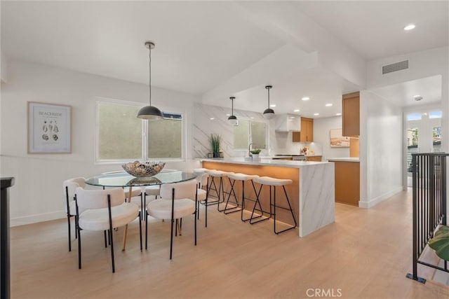 1529 Steinhart Ave, Redondo Beach, CA 90278 - dining area with light wood finished floors, healthy amount of natural light, baseboards, recessed lighting, and lofted ceiling