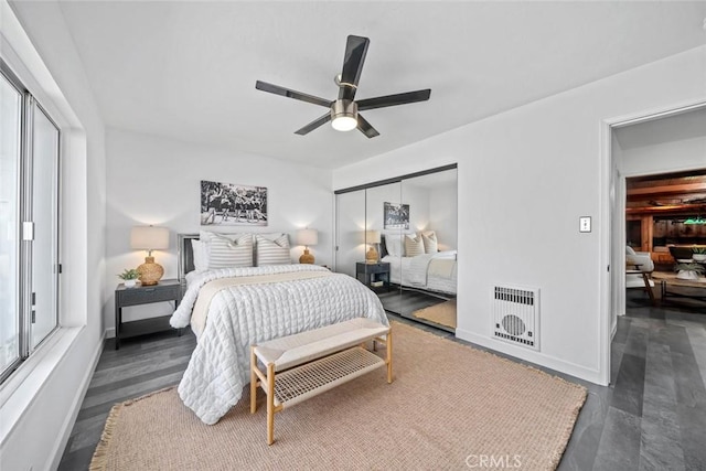 1000 Park Ave, Cayucos, CA 93430 - bedroom featuring wood finished floors, heating unit, a closet, and ceiling fan