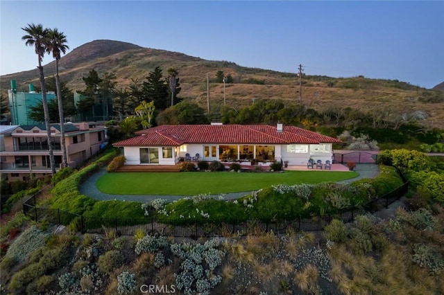 1000 Park Ave, Cayucos, CA 93430 - rear view of house with a tile roof, a chimney, and a mountain view