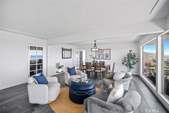 1000 Park Ave, Cayucos, CA 93430 - living room with dark wood-type flooring, plenty of natural light, and baseboards