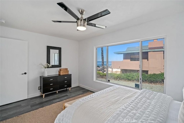 1000 Park Ave, Cayucos, CA 93430 - bedroom with dark wood finished floors, baseboards, ceiling fan, and access to outside