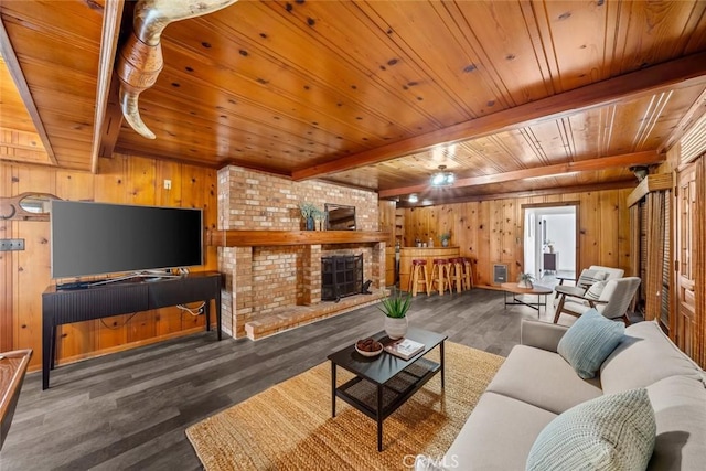 1000 Park Ave, Cayucos, CA 93430 - living room featuring wood ceiling with exposed beams, wood walls, wood finished floors, and ceiling fan