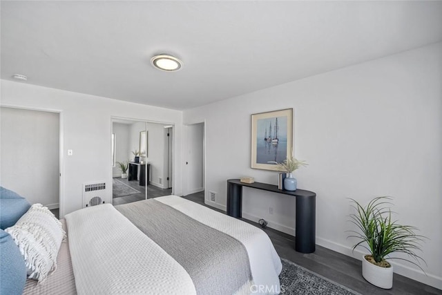 1000 Park Ave, Cayucos, CA 93430 - bedroom featuring a closet, baseboards, wood finished floors, and radiator