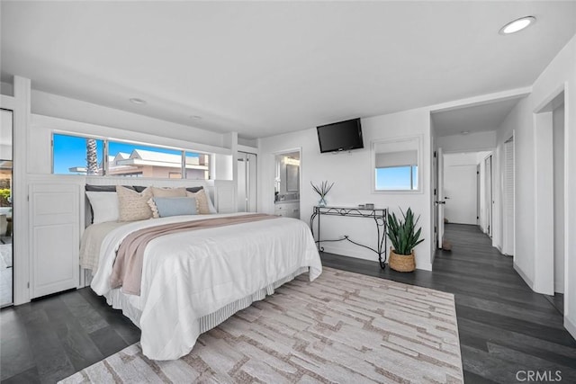1000 Park Ave, Cayucos, CA 93430 - bedroom with multiple windows, recessed lighting, dark wood-style floors, and ensuite bath