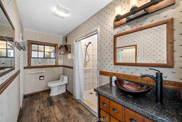 1000 Park Ave, Cayucos, CA 93430 - full bath featuring wallpapered walls, a stall shower, vanity, toilet, and wood finished floors