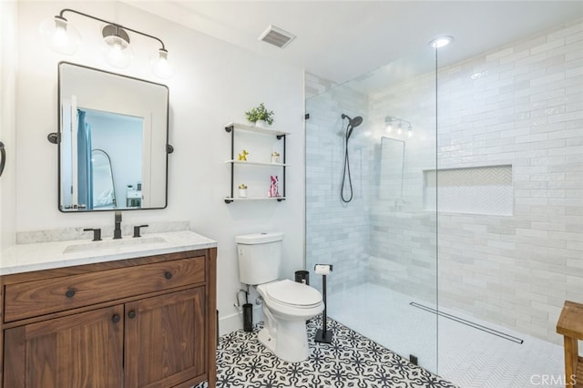 2665 E Vincentia Rd, Palm Springs, CA 92262 - full bath featuring vanity, a walk in shower, toilet, and tile patterned flooring