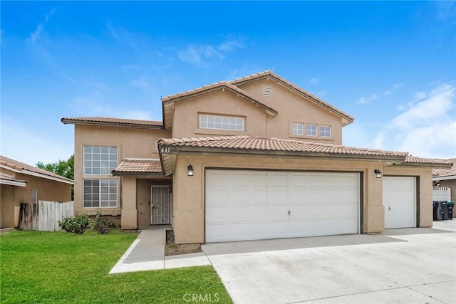 44124 Sundance Ct, Lancaster, CA 93535 - view of front of house featuring concrete driveway, a garage, stucco siding, and a tiled roof