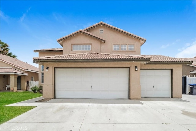 44124 Sundance Ct, Lancaster, CA 93535 - mediterranean / spanish house featuring driveway, a garage, stucco siding, and a tiled roof
