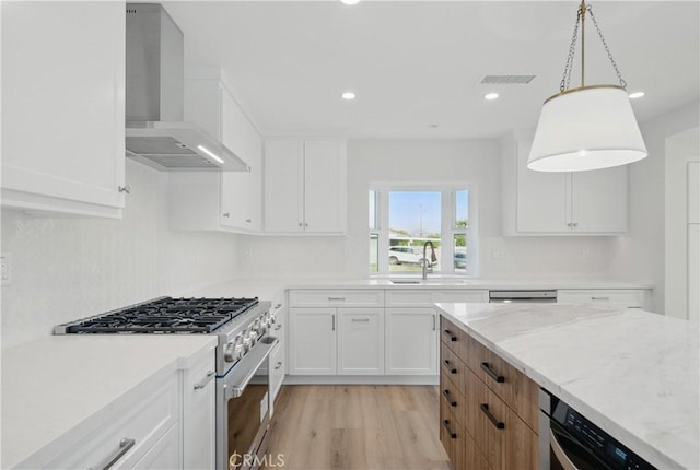830 Huerta Verde Rd, Glendora, CA 91741 - kitchen featuring high end range, wall chimney exhaust hood, a sink, white cabinetry, and light wood-type flooring