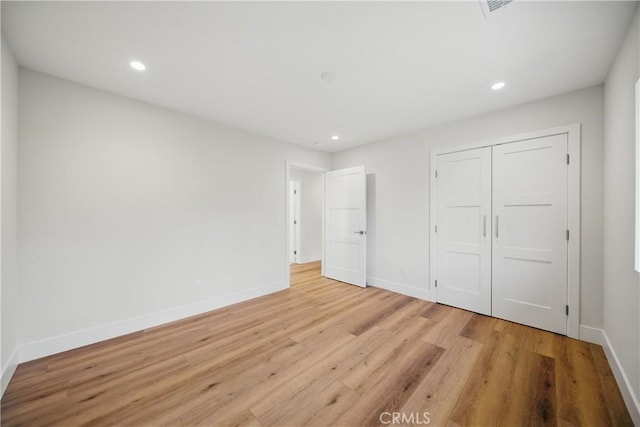 830 Huerta Verde Rd, Glendora, CA 91741 - unfurnished bedroom featuring light wood-type flooring, recessed lighting, baseboards, and a closet