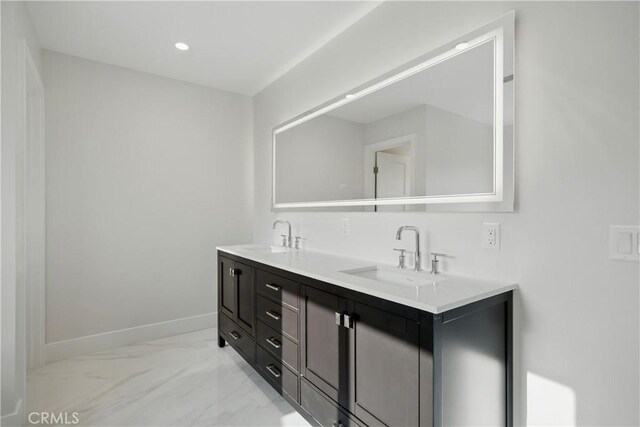830 Huerta Verde Rd, Glendora, CA 91741 - bathroom with double vanity, marble finish floors, baseboards, and recessed lighting