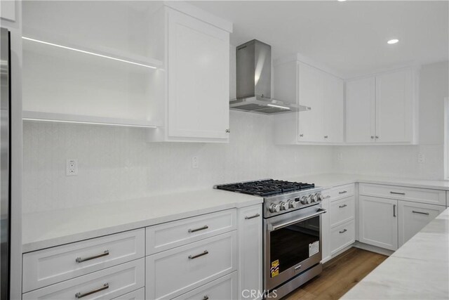 830 Huerta Verde Rd, Glendora, CA 91741 - kitchen with wall chimney range hood, stainless steel range, white cabinetry, dark wood-style flooring, and recessed lighting