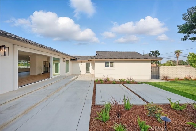 830 Huerta Verde Rd, Glendora, CA 91741 - back of house with a tile roof, stucco siding, and a patio area