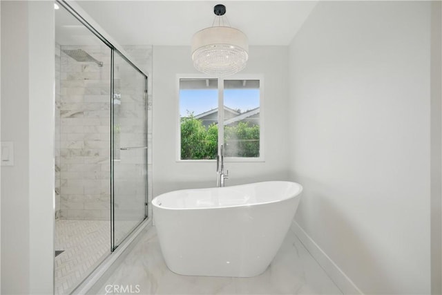 830 Huerta Verde Rd, Glendora, CA 91741 - full bath with marble look tile flooring, a shower stall, a soaking tub, and baseboards