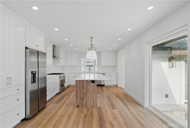830 Huerta Verde Rd, Glendora, CA 91741 - kitchen featuring stainless steel appliances, wall chimney range hood, white cabinetry, light countertops, and recessed lighting