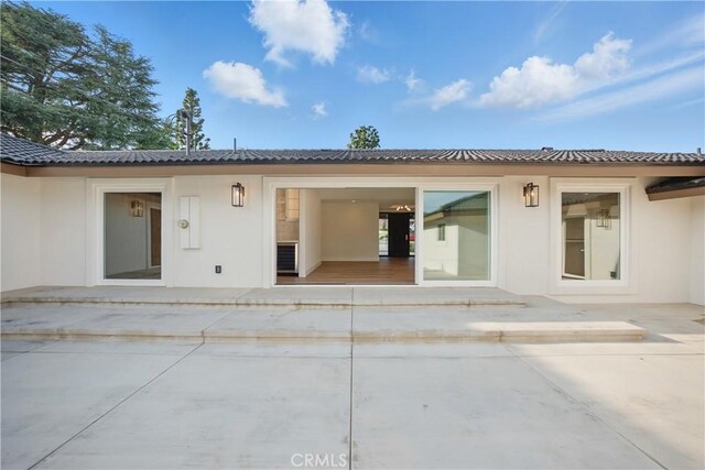 830 Huerta Verde Rd, Glendora, CA 91741 - back of house with stucco siding and a patio