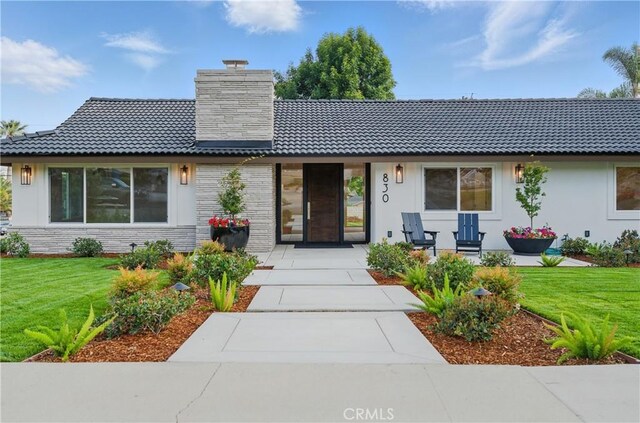 830 Huerta Verde Rd, Glendora, CA 91741 - view of front facade with a chimney, a front lawn, stucco siding, and covered porch