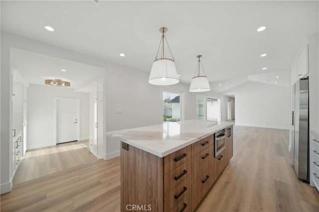 830 Huerta Verde Rd, Glendora, CA 91741 - kitchen featuring light wood-style flooring, a center island, recessed lighting, light stone countertops, and hanging light fixtures