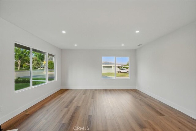 830 Huerta Verde Rd, Glendora, CA 91741 - spare room featuring healthy amount of natural light, wood finished floors, recessed lighting, and baseboards
