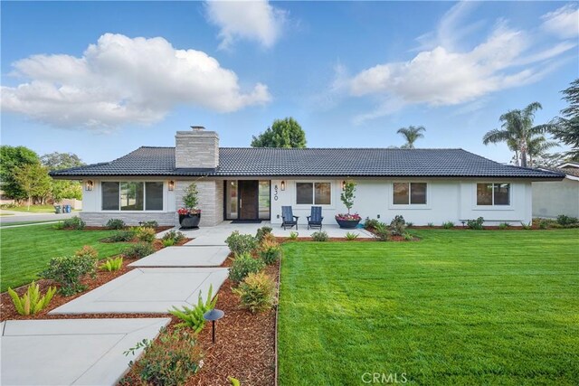 830 Huerta Verde Rd, Glendora, CA 91741 - ranch-style home featuring a chimney, a front lawn, a tile roof, and stucco siding