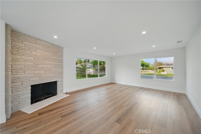 830 Huerta Verde Rd, Glendora, CA 91741 - unfurnished living room featuring a stone fireplace, wood finished floors, baseboards, and recessed lighting