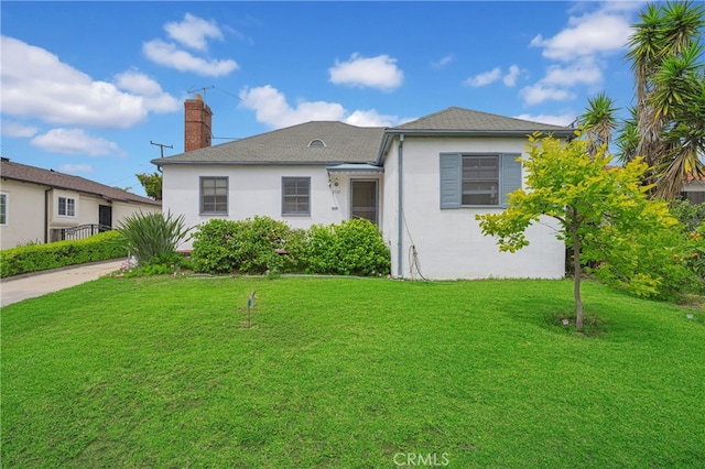 2121 Westminster Ave, Alhambra, CA 91803 - view of front facade featuring stucco siding, a chimney, and a front lawn