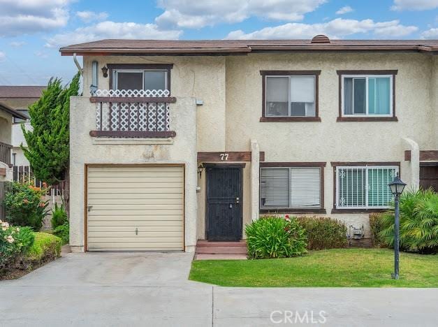 4177 Walnut Grove Ave, Rosemead, CA 91770 - view of front facade featuring stucco siding, a garage, and concrete driveway