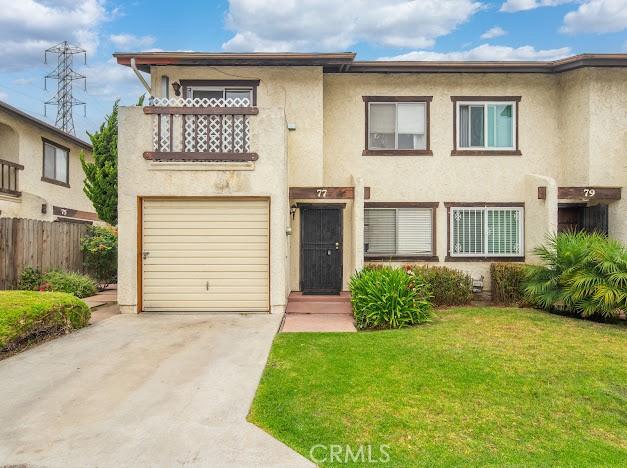 4177 Walnut Grove Ave, Rosemead, CA 91770 - townhome / multi-family property featuring a balcony, stucco siding, a garage, and driveway