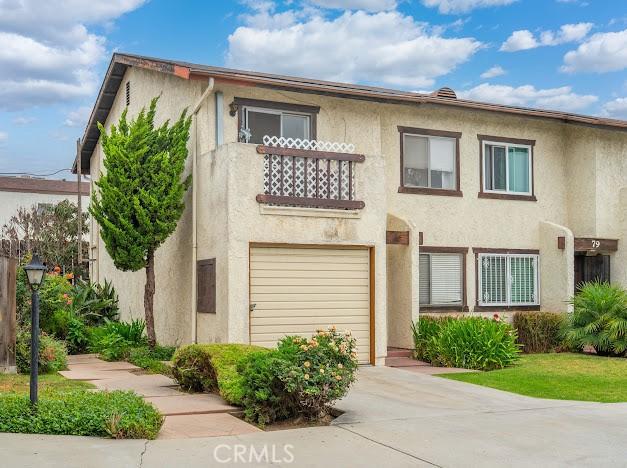 4177 Walnut Grove Ave, Rosemead, CA 91770 - townhome / multi-family property featuring stucco siding, concrete driveway, an attached garage, and a balcony
