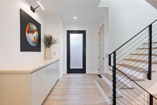 622 1st Pl, Hermosa Beach, CA 90254 - entryway featuring light wood-style flooring, stairs, recessed lighting, and baseboards