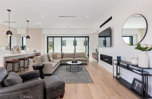 622 1st Pl, Hermosa Beach, CA 90254 - living area with light wood finished floors, recessed lighting, and baseboards