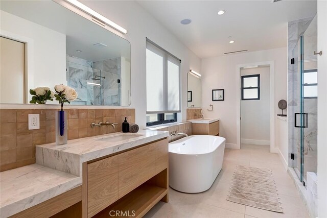 622 1st Pl, Hermosa Beach, CA 90254 - full bath featuring a marble finish shower, plenty of natural light, two vanities, and recessed lighting