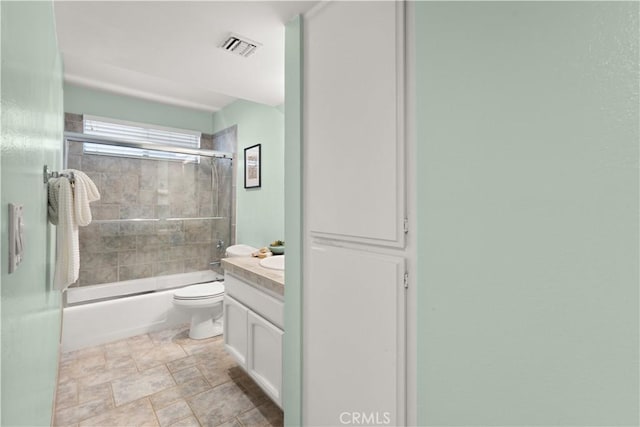 1425 E 2nd St Unit 101, Long Beach, CA 90802 - full bath featuring bath / shower combo with glass door, vanity, and stone finish floors