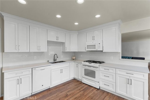 480 Mindoro St, Morro Bay, CA 93442 - kitchen with white appliances, a sink, white cabinets, light countertops, and dark wood-style flooring