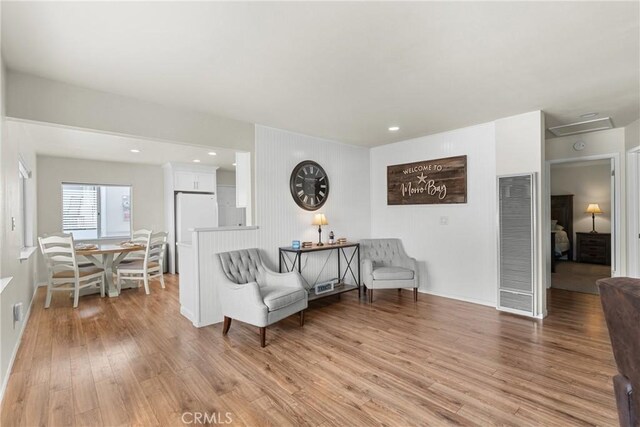 480 Mindoro St, Morro Bay, CA 93442 - living area featuring a heating unit, light wood-type flooring, and baseboards
