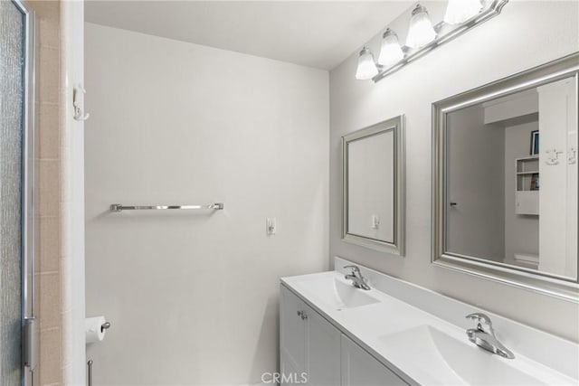 480 Mindoro St, Morro Bay, CA 93442 - full bathroom with double vanity, toilet, and an enclosed shower